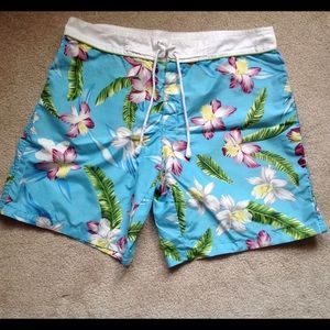 Turquoise floral board shorts, size M